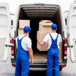 Jersey City movers packing boxes in living room