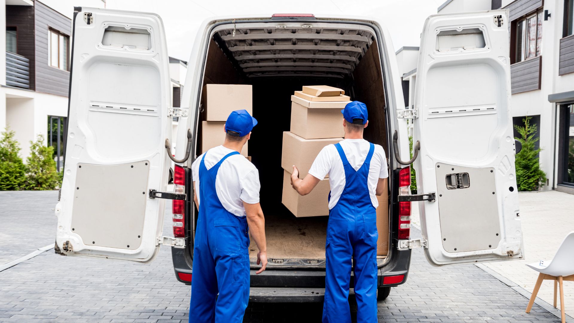Jersey City movers packing boxes in living room
