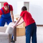 NJ movers and packers carefully boxing household items for a New Jersey move.